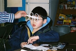 A child getting examined for his New Eyes glasses